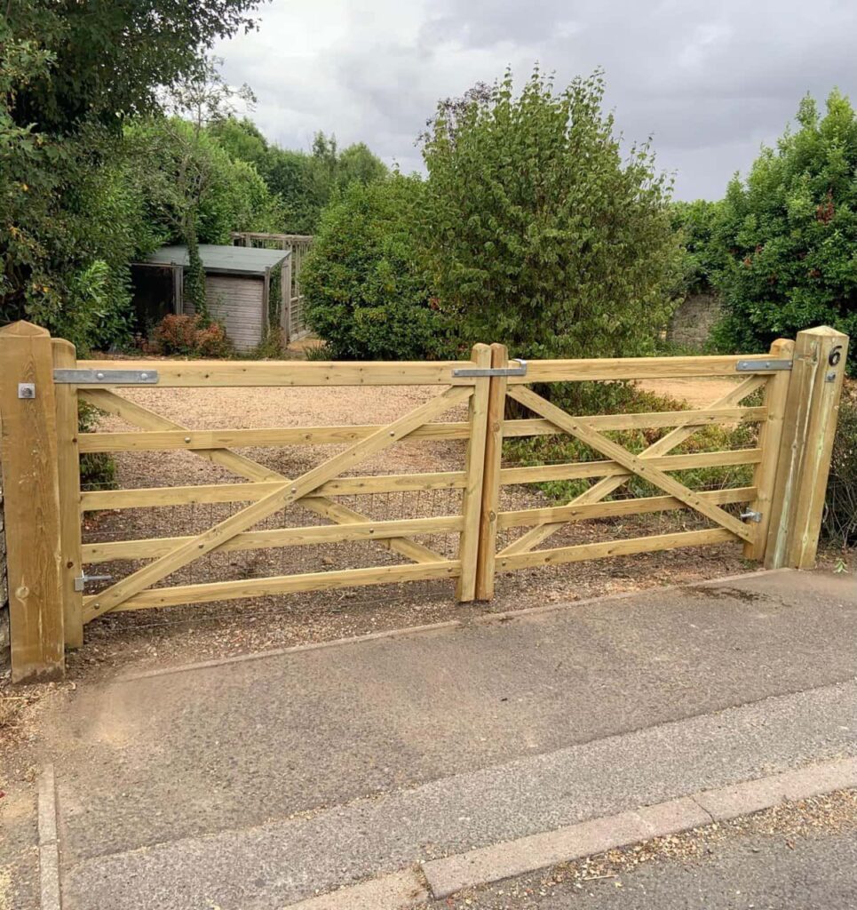 This is a photo of a wooden driveway gate installed by Fast Fix Fencing Cottenham